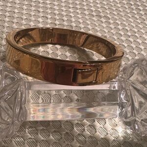 J.Crew Heavy weight, gold tone bangle with clasp to open. Easy to wear. EUC